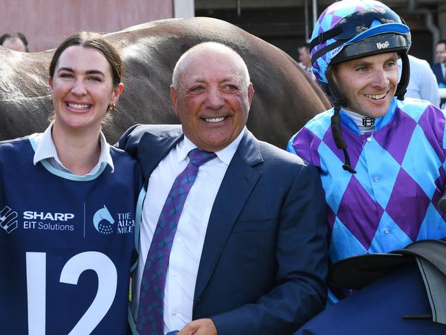 MELBOURNE, AUSTRALIA - MARCH 16: Declan Bates poses with owner Tony Ottobre after Pride of Jenni won Race 8, the The Sharp Eit All-star Mile, during The All-Star Mile Race Day at Caulfield Racecourse on March 16, 2024 in Melbourne, Australia. (Photo by Vince Caligiuri/Getty Images)