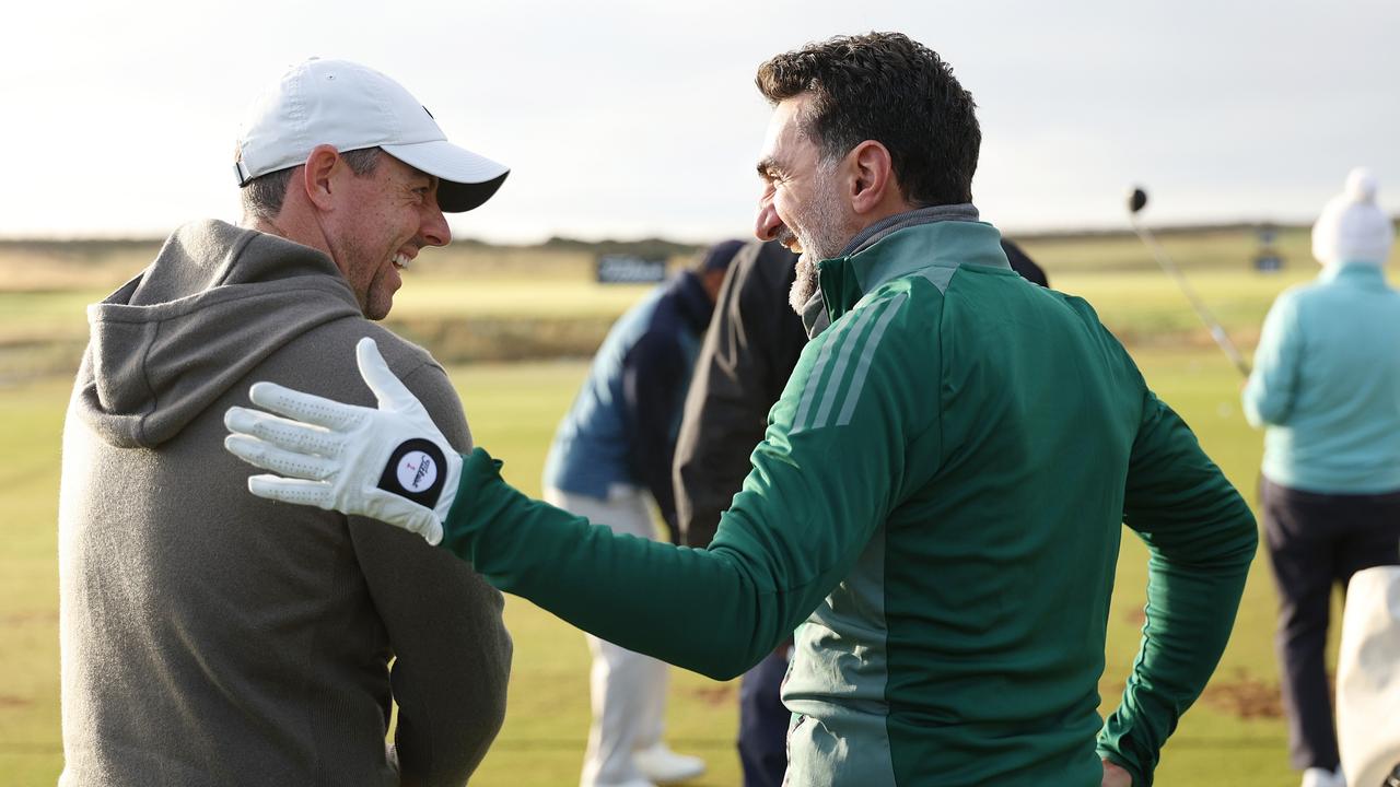 Rory McIlroy and Al-Rumayyan on the practice range ahead. Picture: Richard Heathcote/Getty Images)