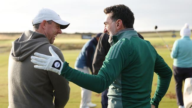 Rory McIlroy and Al-Rumayyan on the practice range ahead. Picture: Richard Heathcote/Getty Images)