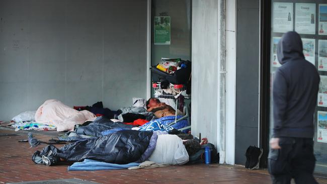 A crowd of homeless people asleep in Nerang St shopping precinct, once the CBD of the Gold Coast. . Picture Glenn Hampson