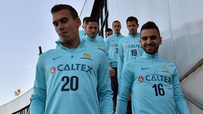 Australia's defenders Trent Sainsbury (L) and Aziz Behich.