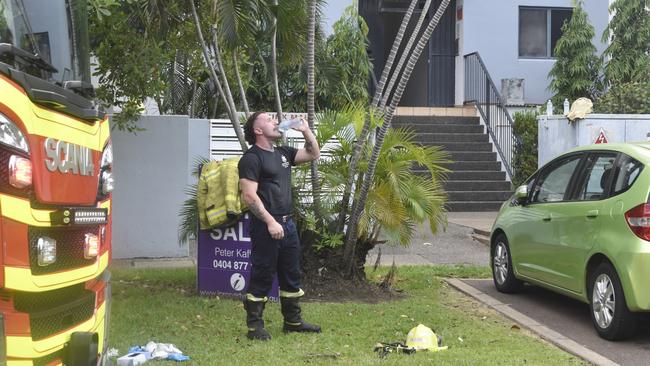 A crew member rehydrates after emergency service responded to the situation. Picture: Harry Brill.