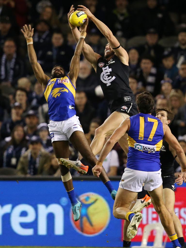 Weitering flies for a mark over Liam Ryan. Picture: Michael Klein