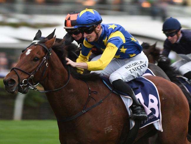 MELBOURNE, AUSTRALIA - APRIL 25: Teodore Nugent riding Our Lone Star winning  Race 8, the Flt Lt Peter Armytage Handicap, during Anzac Day Race Day at Flemington Racecourse on April 25, 2021 in Melbourne, Australia. (Photo by Vince Caligiuri/Getty Images)