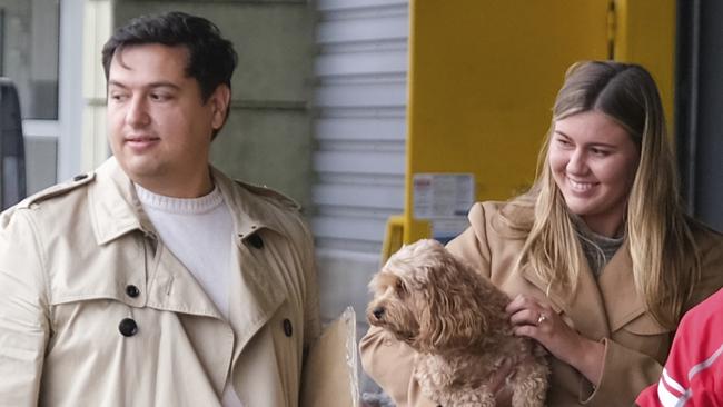 Brittany Higgins and David Sharaz with their cavapoodle dog Kingston in France. Picture: Jacquelin Magnay