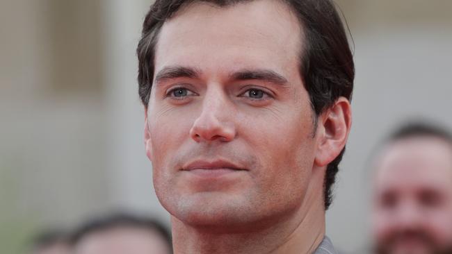 British actor Henry Cavill poses on the red carpet as he arrives to attend the world premiere of his new film Mission: Impossible – Fallout, on July 12, 2018 at the Theatre de Chaillot in Paris.   / AFP PHOTO / Thomas SAMSON