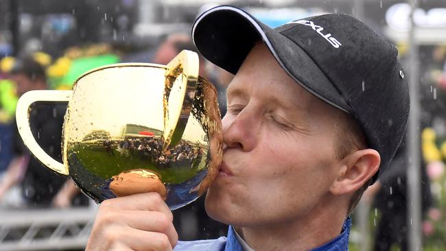 Kerrin McEvoy kisses the cup after winning the 2018 Melbourne Cup. Picture: William West / AFP