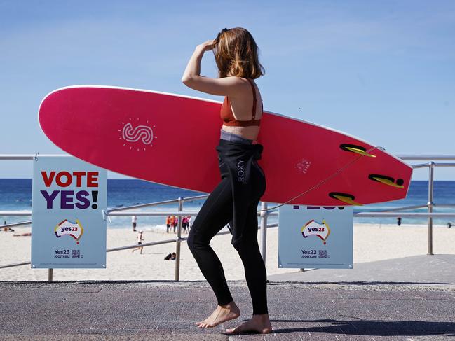 A surfer returns to the waves after casting her vote in the 2023 Voice referendum. Picture: Sam Ruttyn