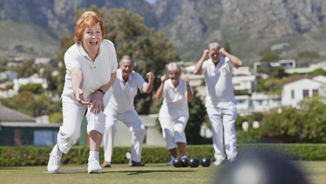 Older couples playing lawn bowling. istock image