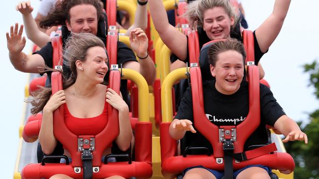 Gemma King and Lochie Holman (in front carriage) with Jack Cassidy and Rebecca King (in second behind them) enjoy the Superman Escape rollercoaster at Movie World on the Gold Coast before the park’s closure due to COVID-19. Picture: Adam Head