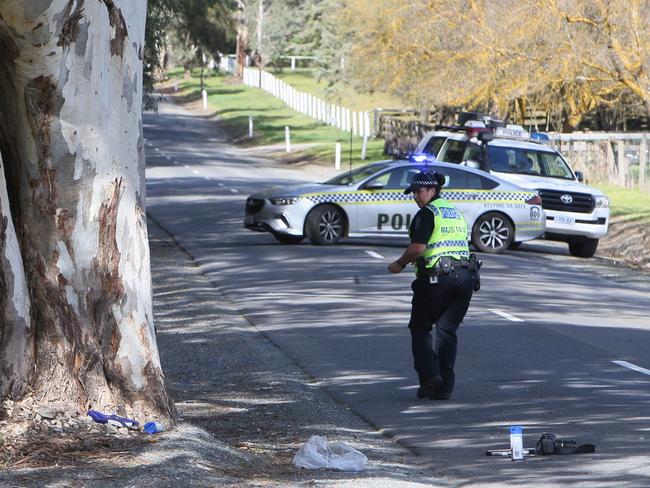 WARNING! PLEASE DO NOT PUBLISH UNTIL FAMILY HAVE BEEN NOTIFIED (Mitch will confirm) AND PIXELATE NUMBER PLATES. Police and Echunga CFS at the scene of a FATAL CAR CRASH on Strathalbyn Road, Echunga, South Australia, just South of Hampton Road. It appears a small red Suzuki travelling towards Hampton Road has collided with a tree on the opposite side of the road. Major Crash Investigators are yet to arrive at the scene. Photographer Emma Brasier.