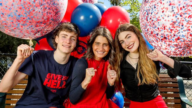 Sam Ludbey-Stynes and her kids Tiernan, 16 and Matisse, 20, celebrating the Demons’. Picture: Tim Carrafa