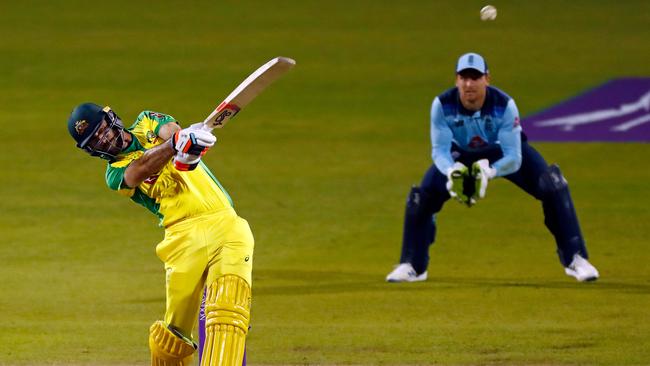 Glenn Maxwell launches the ball towards the leg-side boundary during his record-breaking partnership with Alex Carey Picture: AFP