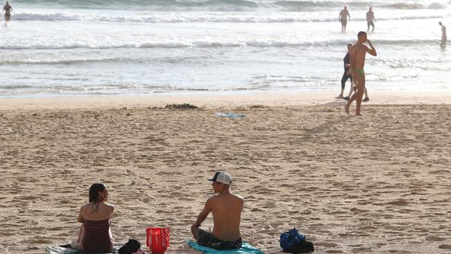 People keeping their distance at Manly Beach this morning. Picture: Rohan Kelly