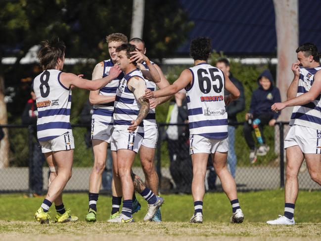 Pearcedale players celebrate a Luke Jennings goal.