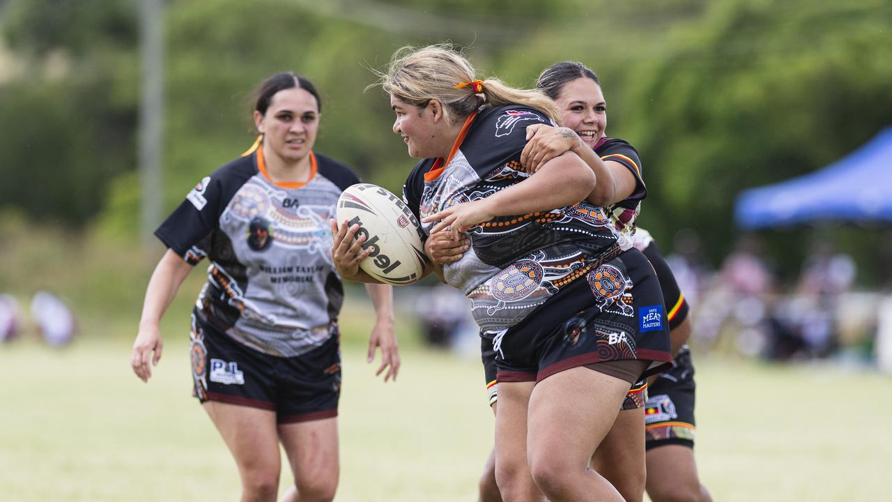 Kiara Taylor of William Taylor Memorial is tackled by Emily Young of Toowoomba Warriors. Picture: Kevin Farmer