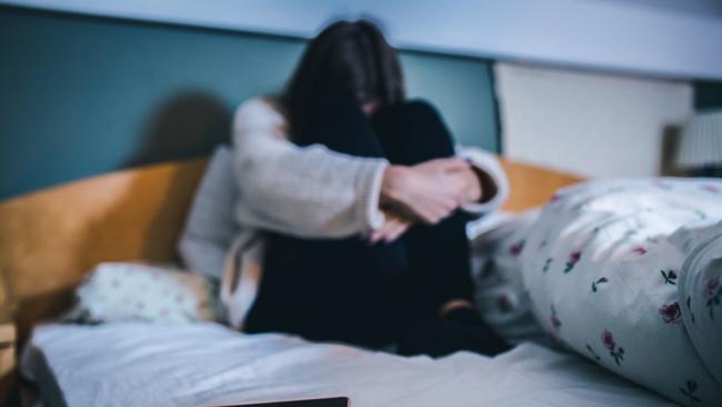 pedophile generic Sad teen with a phone in her bedroom