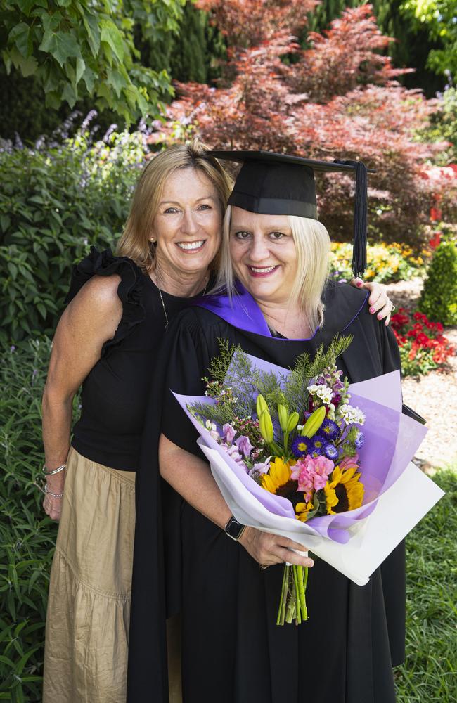 Juris Doctor graduate Cynthia Hawkins celebrates with Susan Williams at a UniSQ graduation ceremony at The Empire, Tuesday, October 29, 2024. Picture: Kevin Farmer