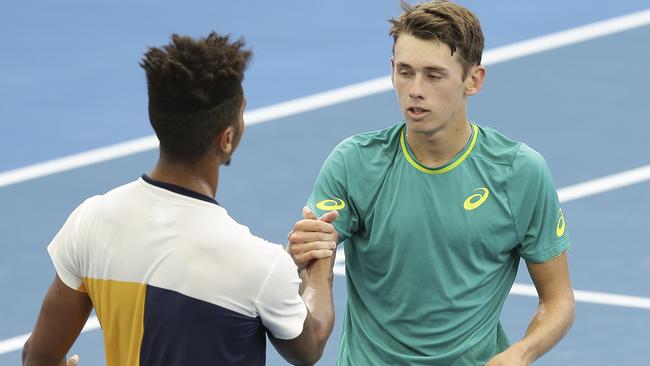 Alex De Minaur shakes hands with Michael Mmoh.