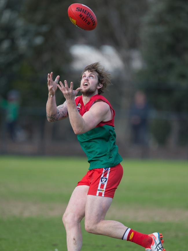 Pines player Tim Bongetti keeps a close eye on the Sherrin. Picture: Gary Bradshaw