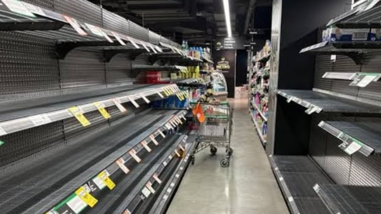 Cyclone panic buying explodes as supermarket shelves stripped bare