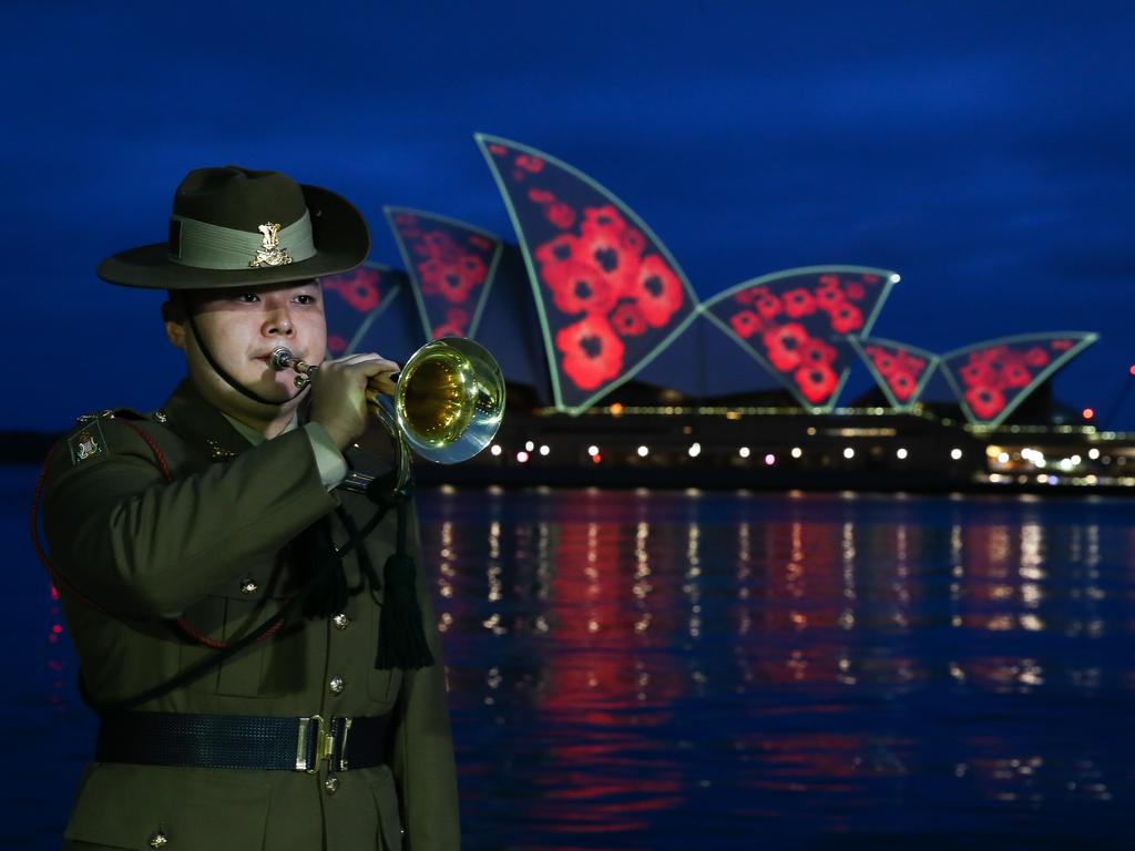 The Remembrance Day Dawn Service with poppies projected on the shells of the Sydney Opera House. Picture: NewsWire / Gaye Gerard