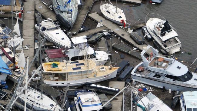 An aerial view of luxury yachts and boats at Port Hinchinbrook that bore the brunt of the destructive winds and storm surge during Cyclone Yasi in 2011. Picture: Evan Morgan