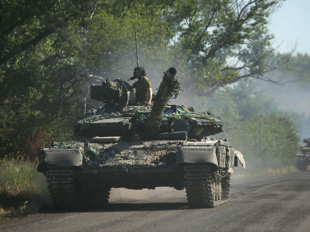 Ukrainian troop move by tanks on a road of the eastern Ukrainian region of Donbas. Picture: AFP