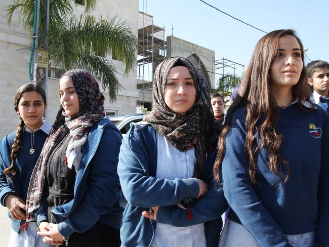 Young girls pay their respects at the funeral.   Picture: Ella Pellegrini