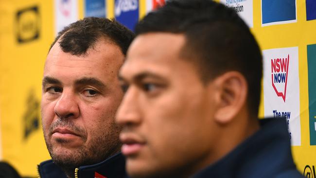 Wallabies coach Michael Cheika looks at Israel Folau during a media conference at the Sydney Cricket Ground in 2015. Picture: Dan Himbrechts