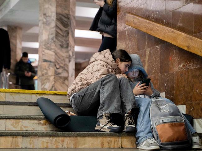 Children take shelter in a metro station during an air strike alarm in Kyiv. Picture: AFP