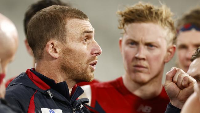 Demons coach Simon Goodwin speaks to his players at quarter time. Picture: AFL Photos/via Getty Images