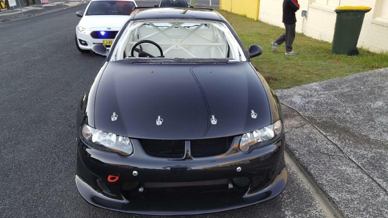 NSW Police highway patrol bust a Holden Commodore without a seat, windscreen or speedometer on the Central Coast. Picture: NSW Police Facebook page.