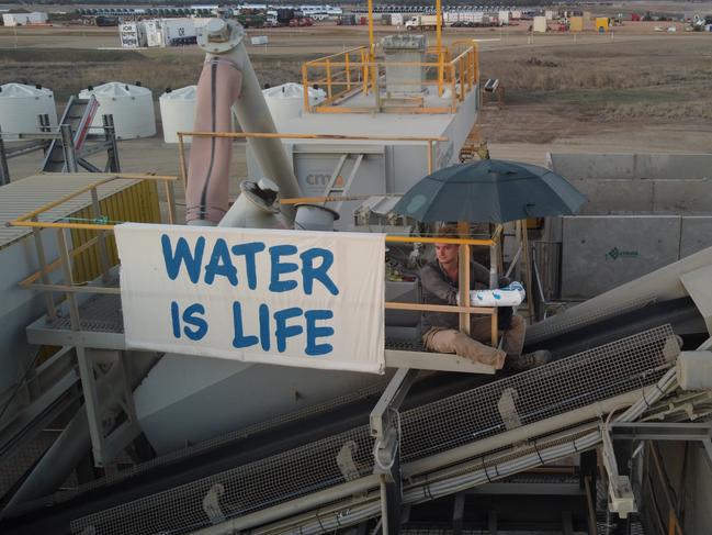 Nelly Bay man Barney Jackson, 23, has been charged after allegedly locking himself to machinery and stopping construction work at Bravus Mining’s rail construction site.