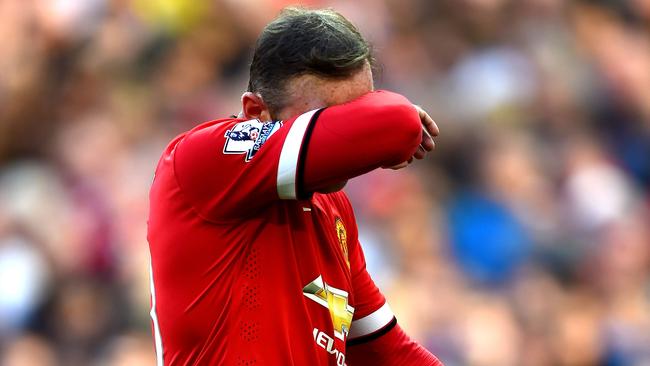 MANCHESTER, ENGLAND - SEPTEMBER 27: Wayne Rooney of Manchester United walks off the pitch after receiving a straight red card following a foul on Stewart Downing of West Ham during the Barclays Premier League match between Manchester United and West Ham United at Old Trafford on September 27, 2014 in Manchester, England. (Photo by Laurence Griffiths/Getty Images)