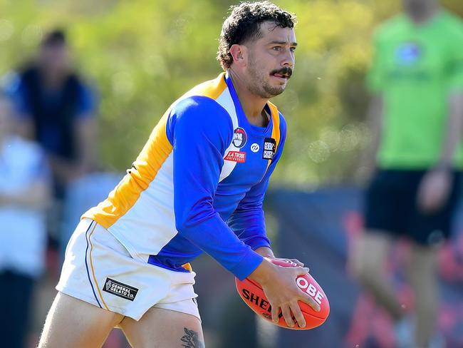 Justin White of Macleod looks to pass the ball during the round three NFNL Division 1 Melbourne Greyhounds Seniors match between West Preston-Lakeside and Macleod at JE Moore Park Oval, on April 27, 2024, in Melbourne, Australia. (Photo by Josh Chadwick)