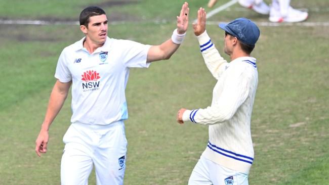HOBART, AUSTRALIA - MARCH 16: Sean Abbott of New South Wales celebrates the wicket of Matt Kuhnemann of Tasmania during the Sheffield Shield match between Tasmania and New South Wales at Blundstone Arena, on March 16, 2025, in Hobart, Australia. (Photo by Steve Bell/Getty Images)