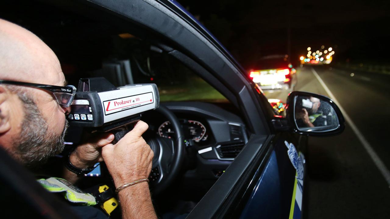 Leading Senior Constable Shane Digman operates a speed detection laser on the Bellarine Highway in the early hours of Wednesday morning. Picture: Alan Barber