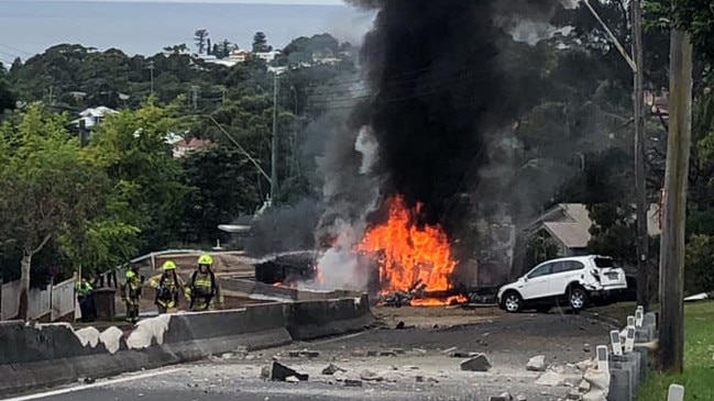 The truck burst into flames after flipping in the middle of the road. Picture: Anthony Turner.