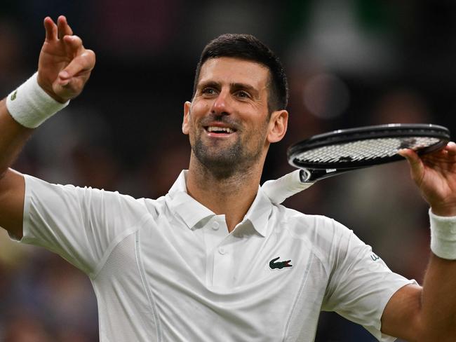 Serbia's Novak Djokovic gestures as he celebrates winning against Australia's Alexei Popyrin during their men's singles tennis match on the sixth day of the 2024 Wimbledon Championships at The All England Lawn Tennis and Croquet Club in Wimbledon, southwest London, on July 6, 2024. (Photo by ANDREJ ISAKOVIC / AFP) / RESTRICTED TO EDITORIAL USE