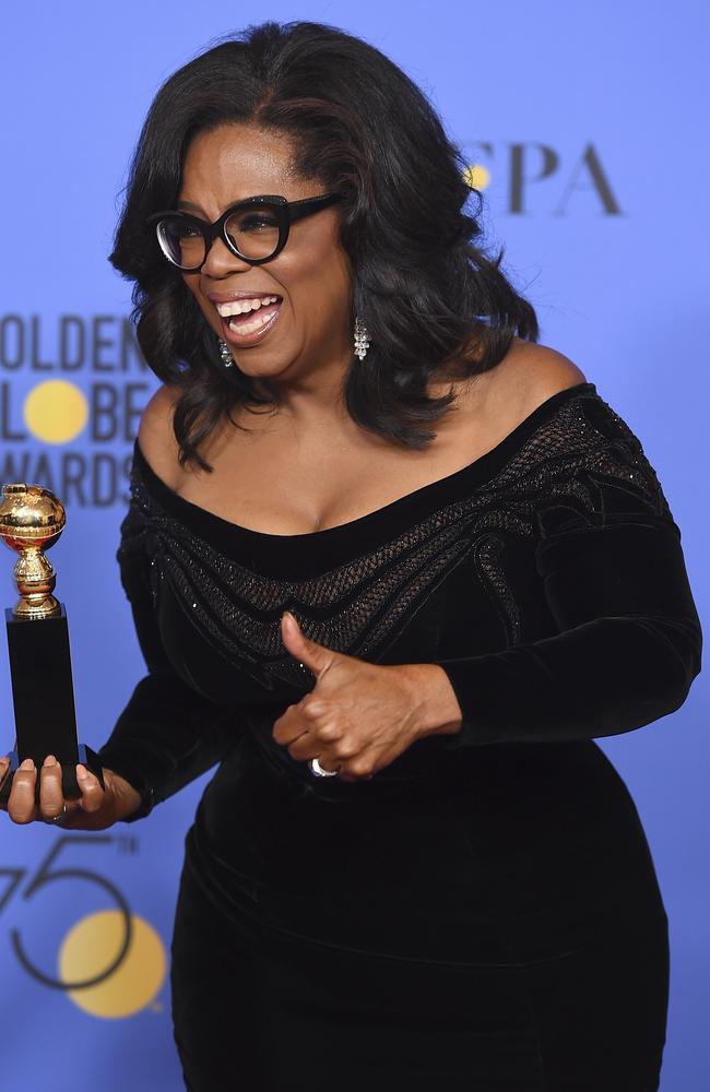 Oprah Winfrey poses in the press room with the Cecil B. DeMille Award at the 75th annual Golden Globe Awards. Picture: AP