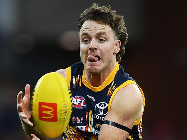 ADELAIDE, AUSTRALIA - JULY 02: James Rowe  of the Crows marks during the round 16 AFL match between the Adelaide Crows and the Melbourne Demons at Adelaide Oval on July 02, 2022 in Adelaide, Australia. (Photo by Mark Brake/Getty Images)