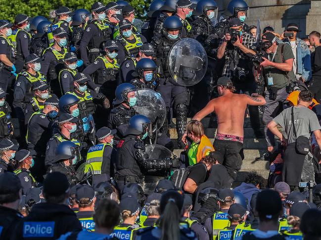 Protesters are confronted by riot police at the Shrine during a protest over Covid lockdowns. Picture: Asanka Ratnayake/Getty Images