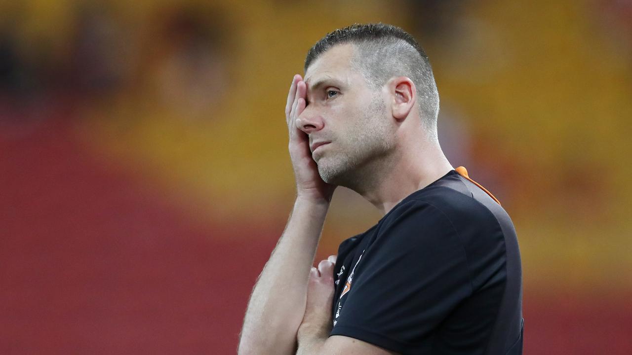 Roar coach Darren Davies looks dejected as Brisbane slumped to another defeat.