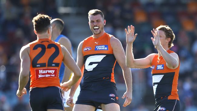 Kieren Briggs celebrates a Giants goal with Josh Kelly. Picture: Phil Hillyard