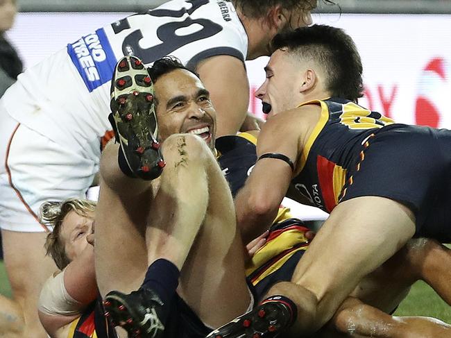 AFL - ROUND 12 - Adelaide Crows v GWS Giants at Adelaide Oval. An Eddie Betts snap seals the victory - celebrating the goal on the ground with Zac Williams.. team mates Lachlan Murphy and Rory Sloane run in to celebrate  Picture SARAH REED