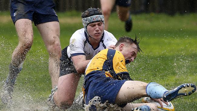 NSW's Joe Hutton tackles ACT's Jake Mead. Pic: John Appleyard