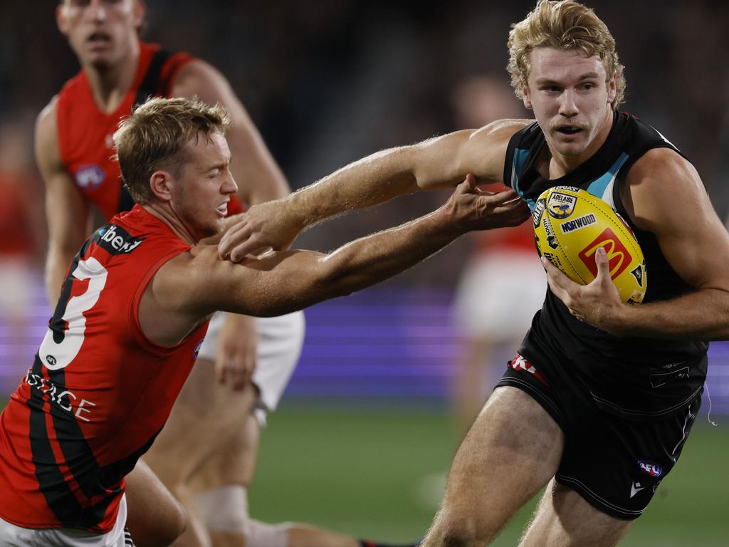 Jason Horne-Francis of the Power fends off Darcy Parish. Picture: Michael Klein