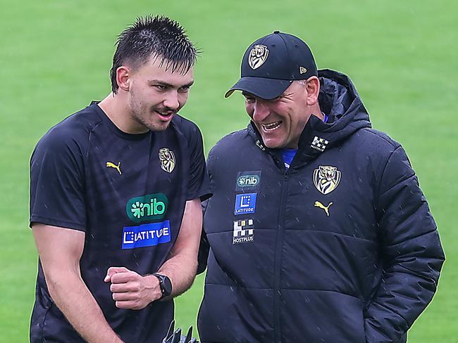 Richmond FC training at Punt Rd oval. New coach for the 2024 season Adem Yze ishares a laugh with Josh Gibcus. Picture: Ian Currie