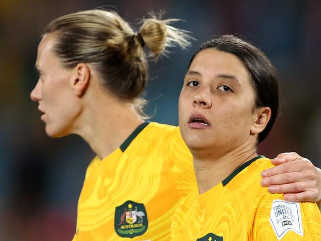 SYDNEY, AUSTRALIA - AUGUST 16: Sam Kerr of Australia is consoled by Emily Van-Egmond after the team's 1-3 defeat and elimination from the tournament following the FIFA Women's World Cup Australia & New Zealand 2023 Semi Final match between Australia and England at Stadium Australia on August 16, 2023 in Sydney / Gadigal, Australia. (Photo by Brendon Thorne/Getty Images)